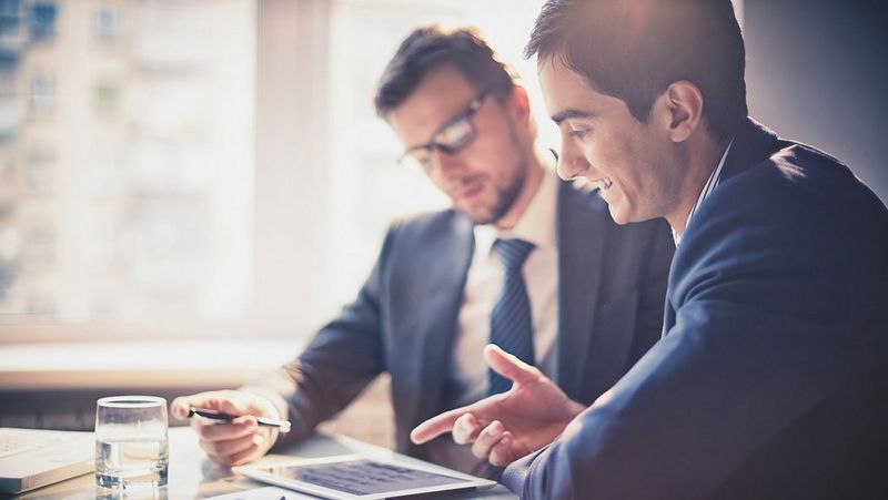 Workers reviewing digital content